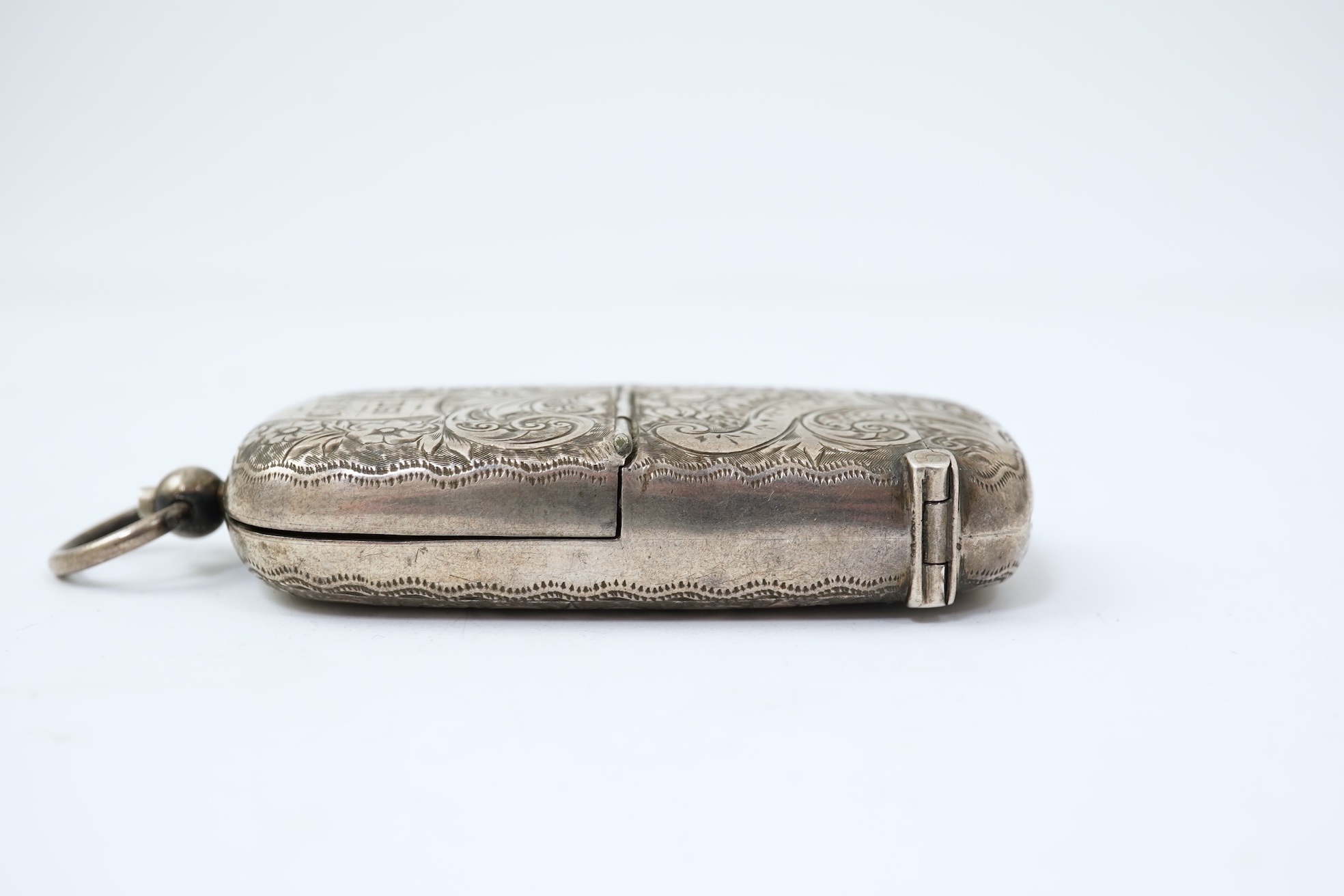 A late Victorian engraved silver oval combination sovereign and vesta case, by JW